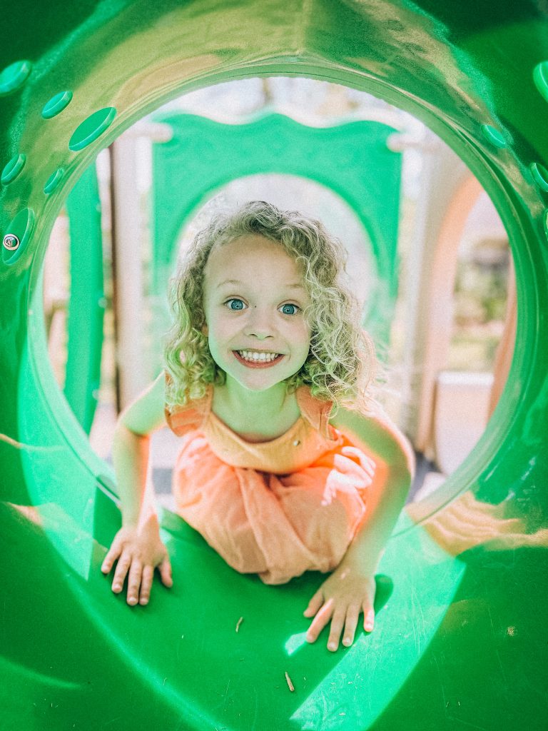 young girl on playground at preschool